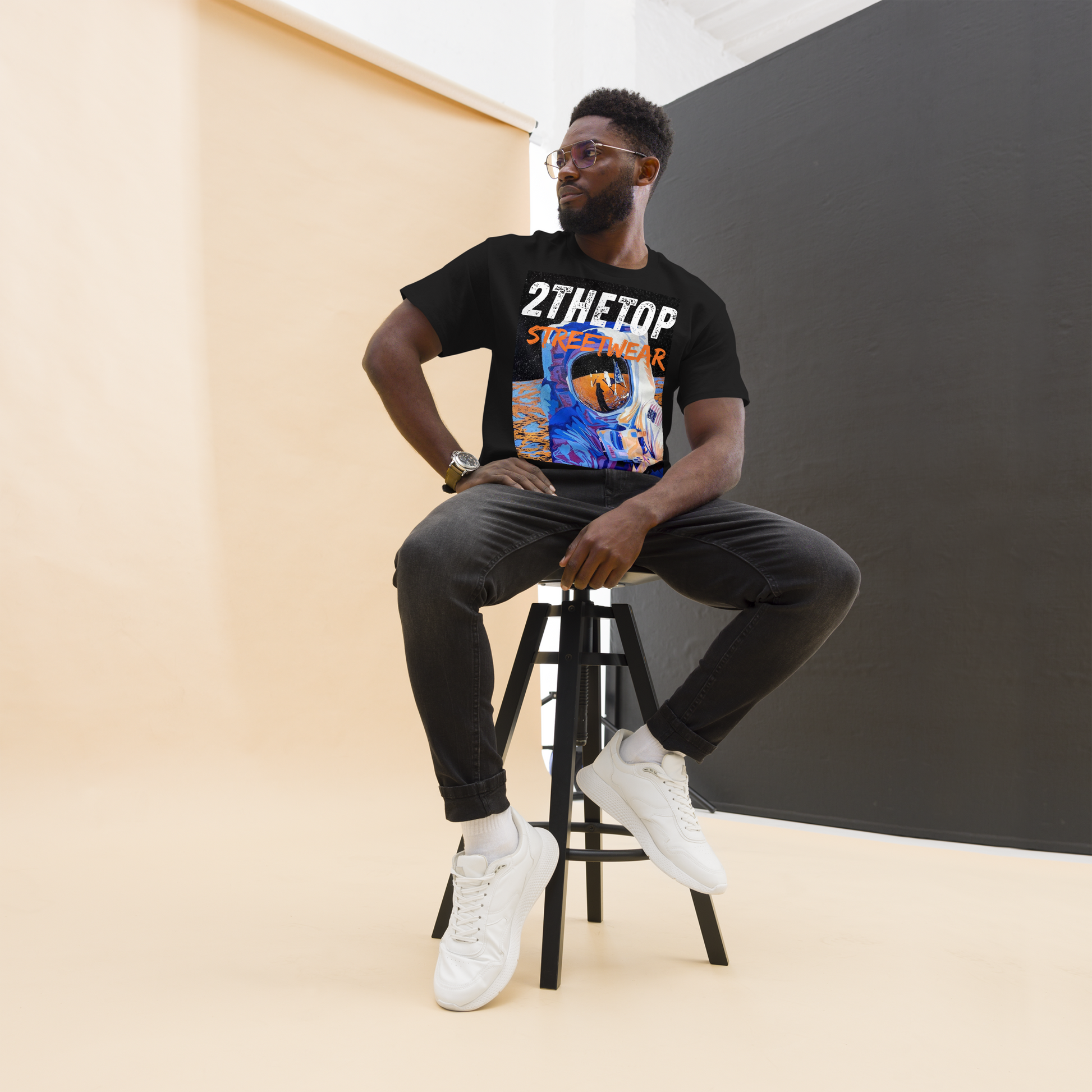 Black graphics t-shirt featuring a bold astronaut design for urban streetwear style