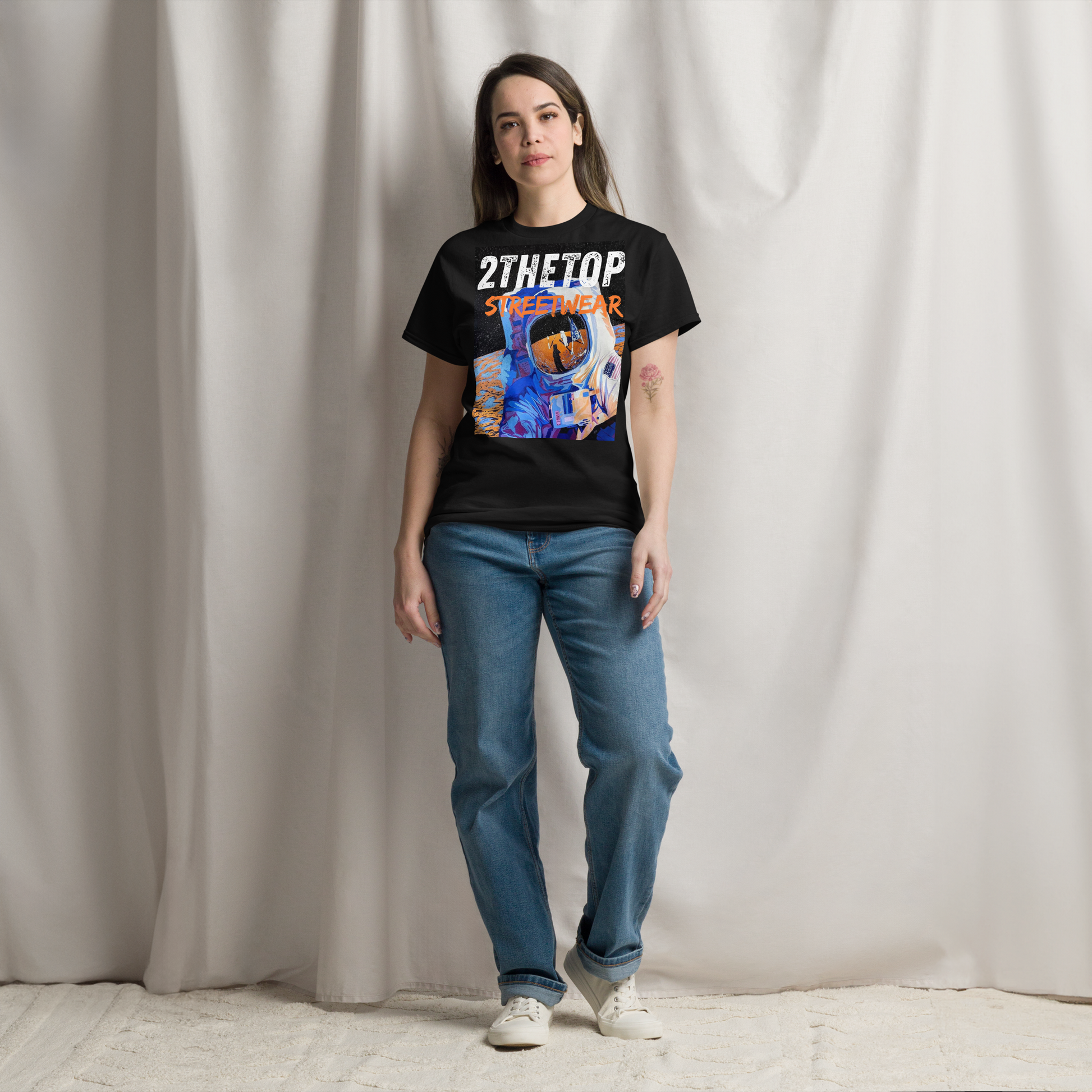 Black graphics t-shirt with bold astronaut design for adult streetwear style