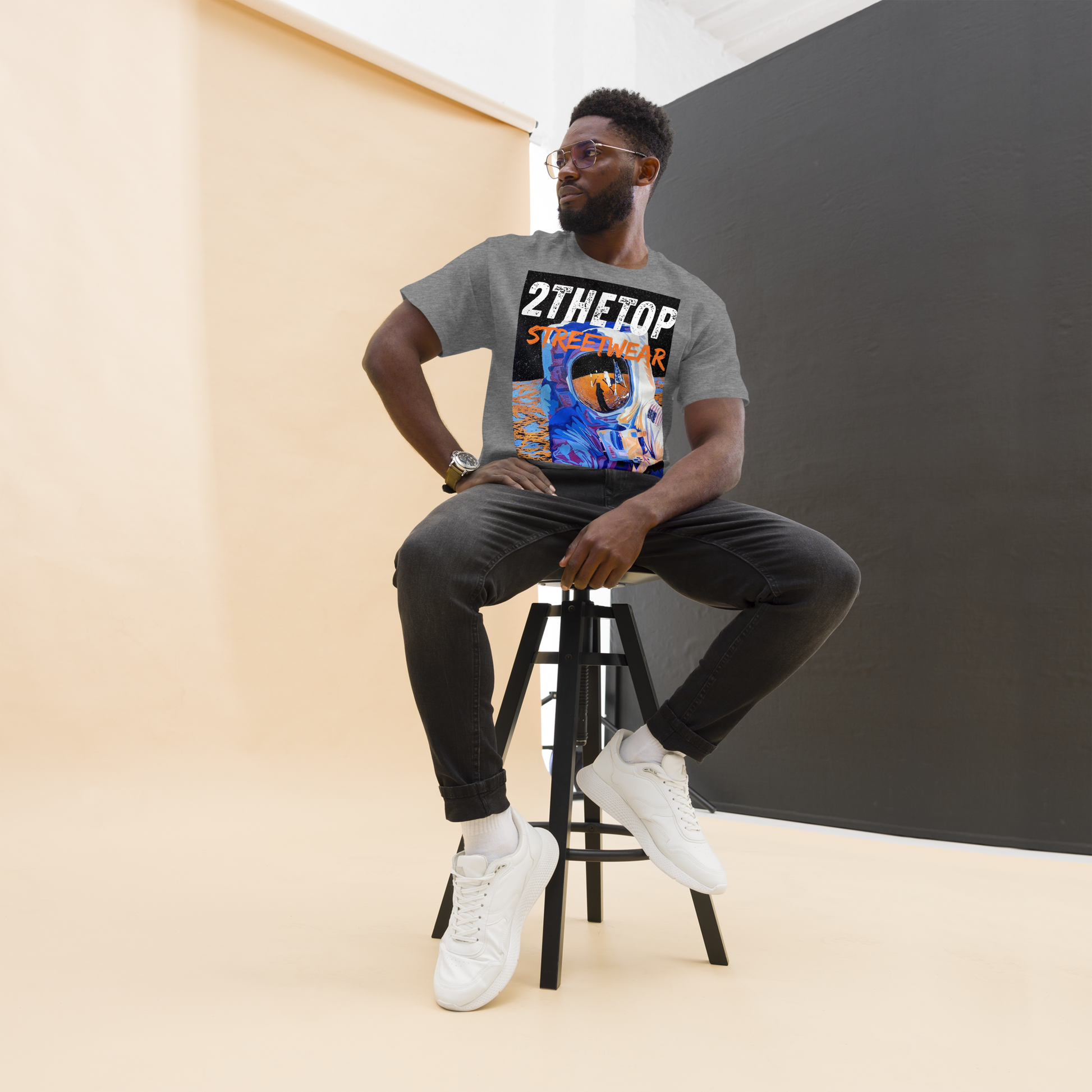 Black graphics t-shirt featuring a bold astronaut design for urban streetwear style.